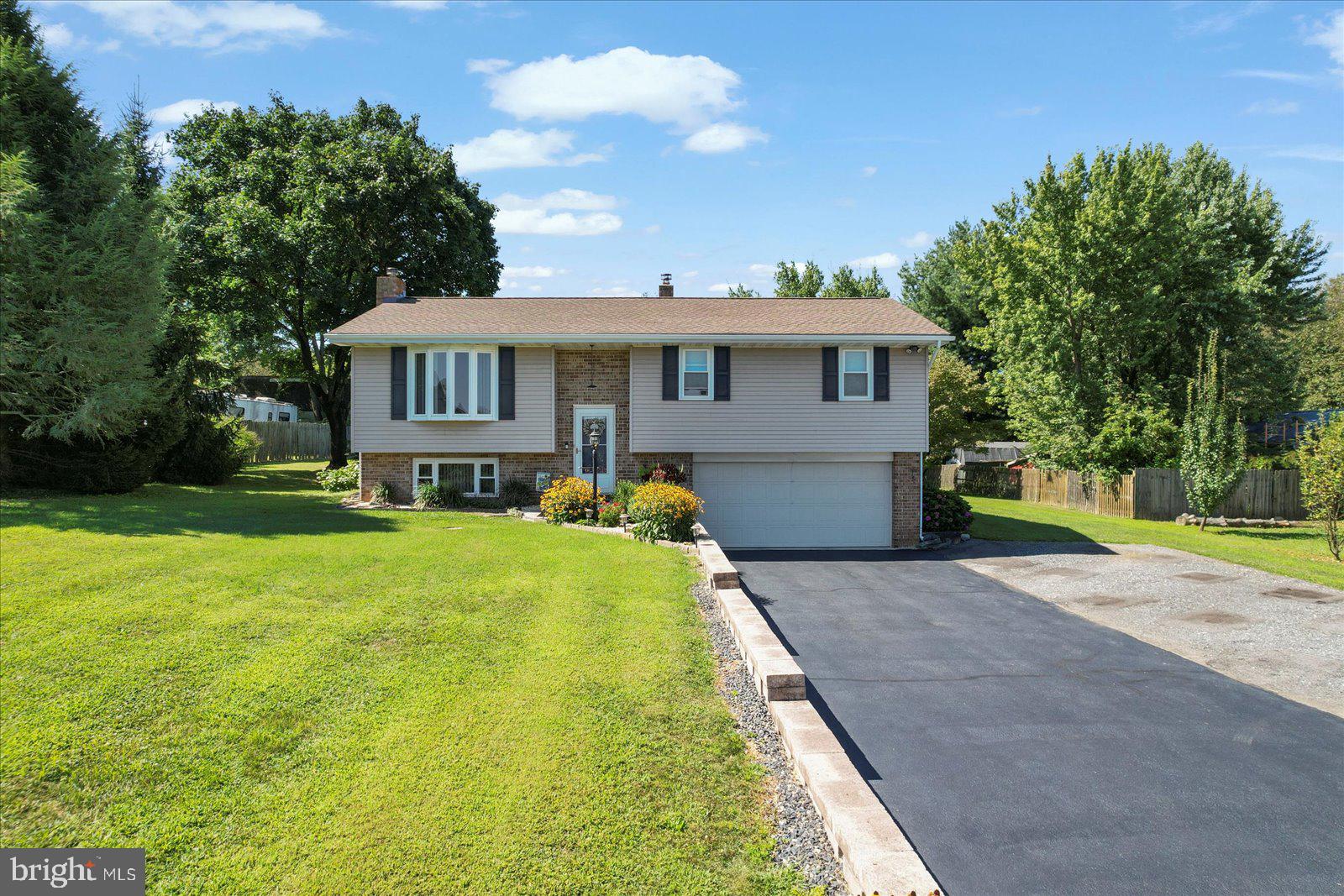 253 Kindig Road Littlestown, PA 17340 - Photo 1 of 41 Charming split-level home on lush lawn.