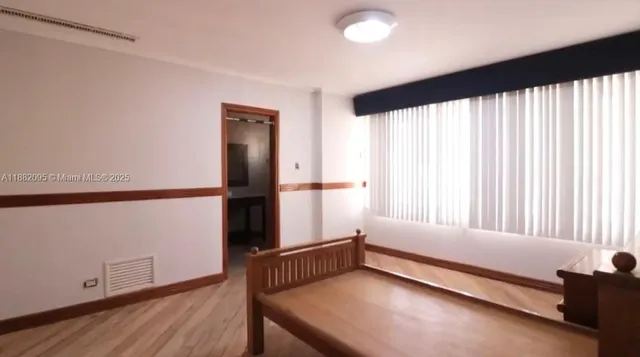 a kitchen with granite countertop white cabinets and a sink