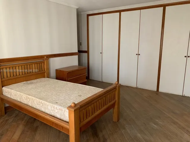 a kitchen with stainless steel appliances granite countertop a sink a stove a refrigerator and island