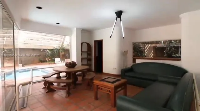 a view of a refrigerator in kitchen and wooden floor