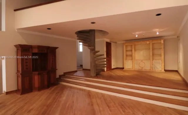 a view of a hallway with windows