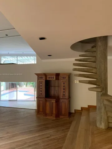 a view of kitchen with a sink and refrigerator