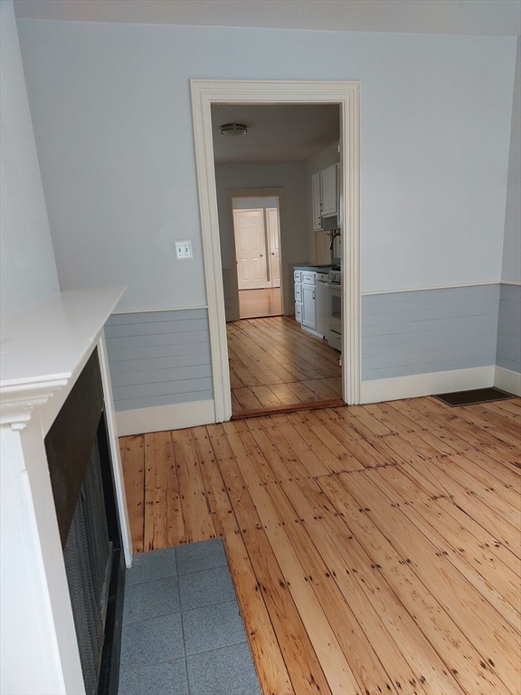 26 Eden Street, Unit 1 Boston, MA 02129 - Photo 12 of 23 a view of a hallway view with wooden floor and staircase