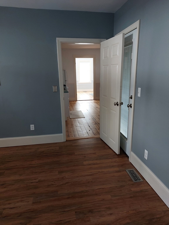 26 Eden Street, Unit 1 Boston, MA 02129 - Photo 13 of 23 a view of wooden floor and windows in a room