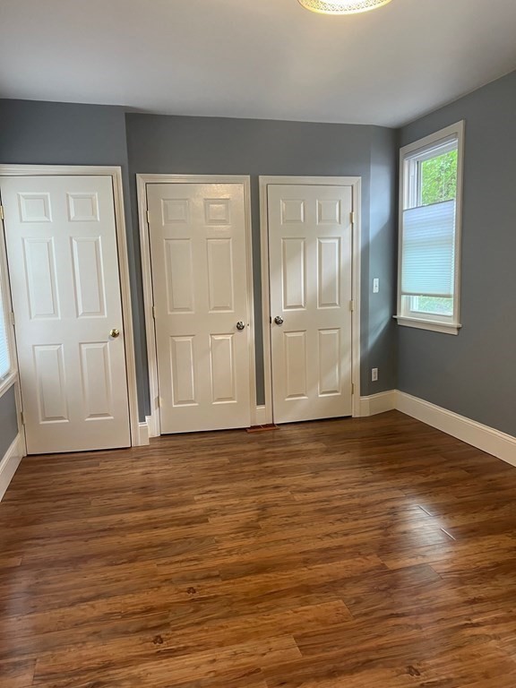 26 Eden Street, Unit 1 Boston, MA 02129 - Photo 16 of 23 a view of wooden floor and windows in a room