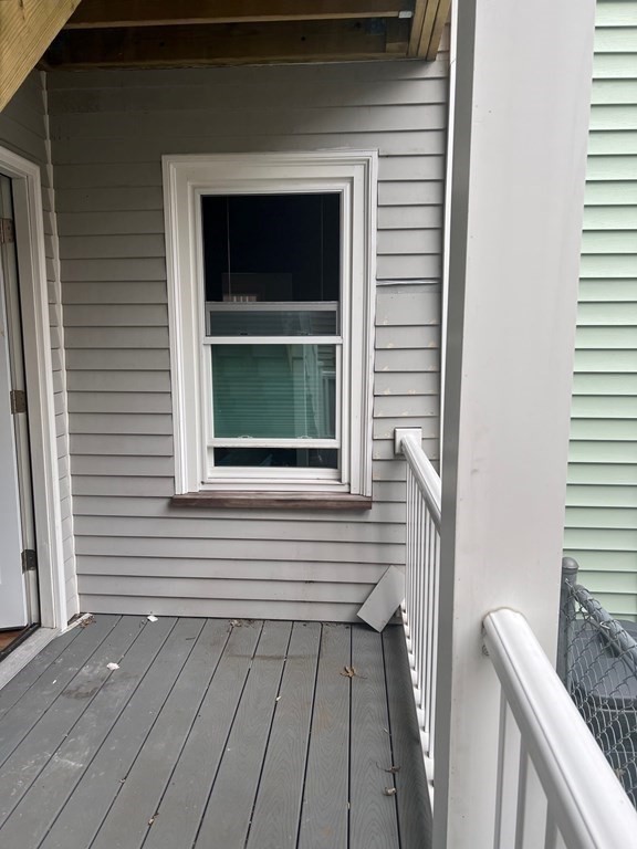 26 Eden Street, Unit 1 Boston, MA 02129 - Photo 21 of 23 a view of a house with a door and a window