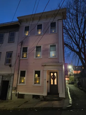 a front view of a house with yard
