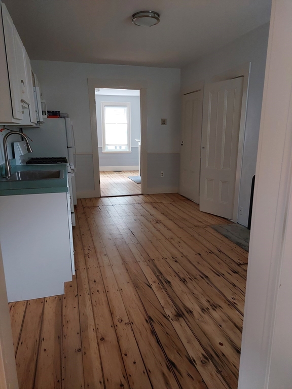 26 Eden Street, Unit 1 Boston, MA 02129 - Photo 5 of 23 a view of a kitchen from the hallway