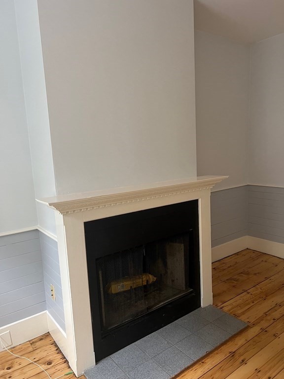 26 Eden Street, Unit 1 Boston, MA 02129 - Photo 7 of 23 a living room with a fireplace