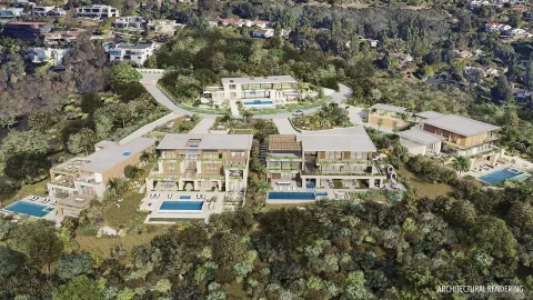 an aerial view of a large building with a yard