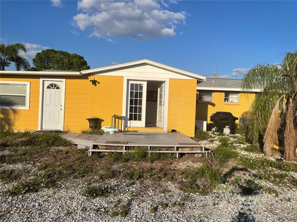 744 Gran Kaymen Way Apollo Beach, FL 33572 - Photo 5 of 12 a front view of a house with garden