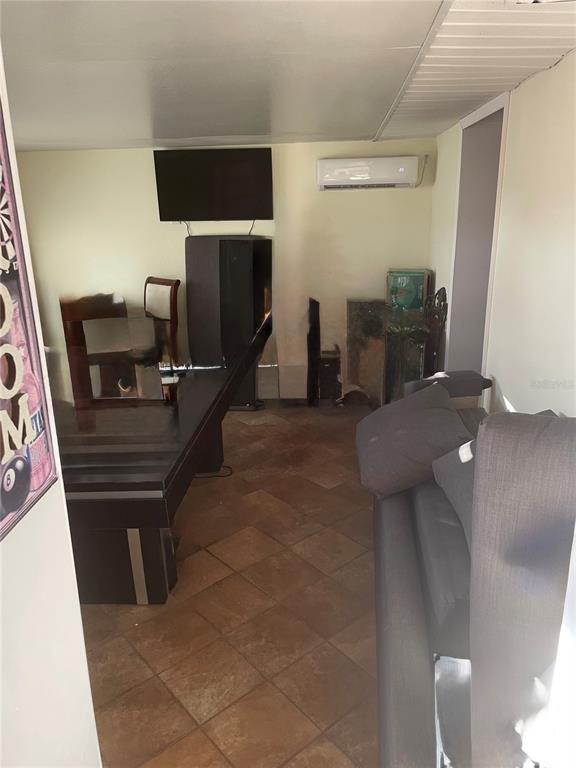 744 Gran Kaymen Way Apollo Beach, FL 33572 - Photo 8 of 12 a living room with furniture and a flat screen tv