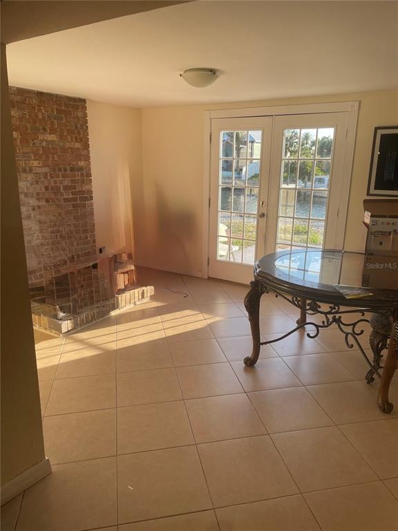 744 Gran Kaymen Way Apollo Beach, FL 33572 - Photo 9 of 12 a spacious bathroom with a mirror a bathtub and next to a window