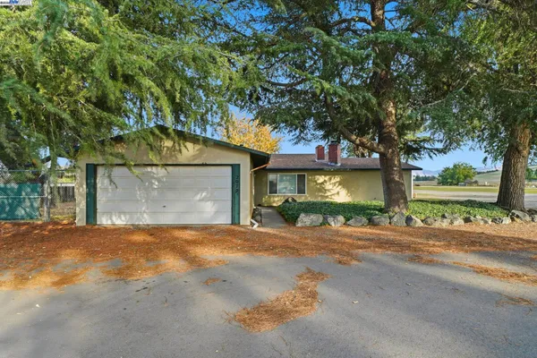 a view of a house with a outdoor space and street view