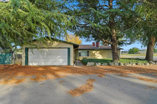 a view of a house with a outdoor space and street view