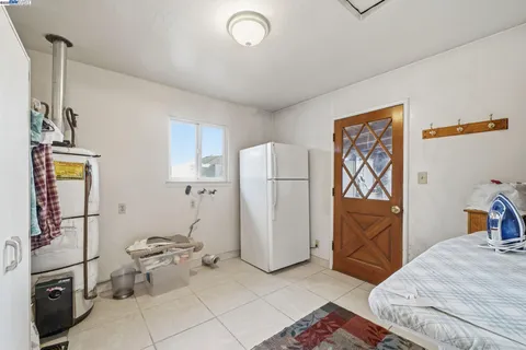 a living room with lots of furniture and a potted plant