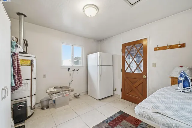 a living room with lots of furniture and a potted plant