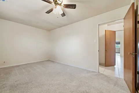 a house view with swimming pool in front of it