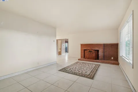 a kitchen with a sink a refrigerator and cabinets