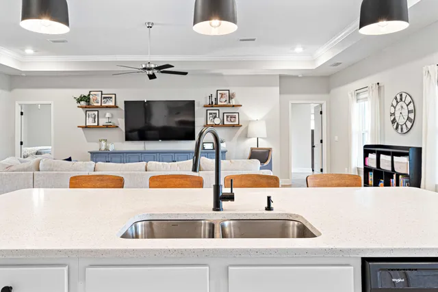 a kitchen view with living room