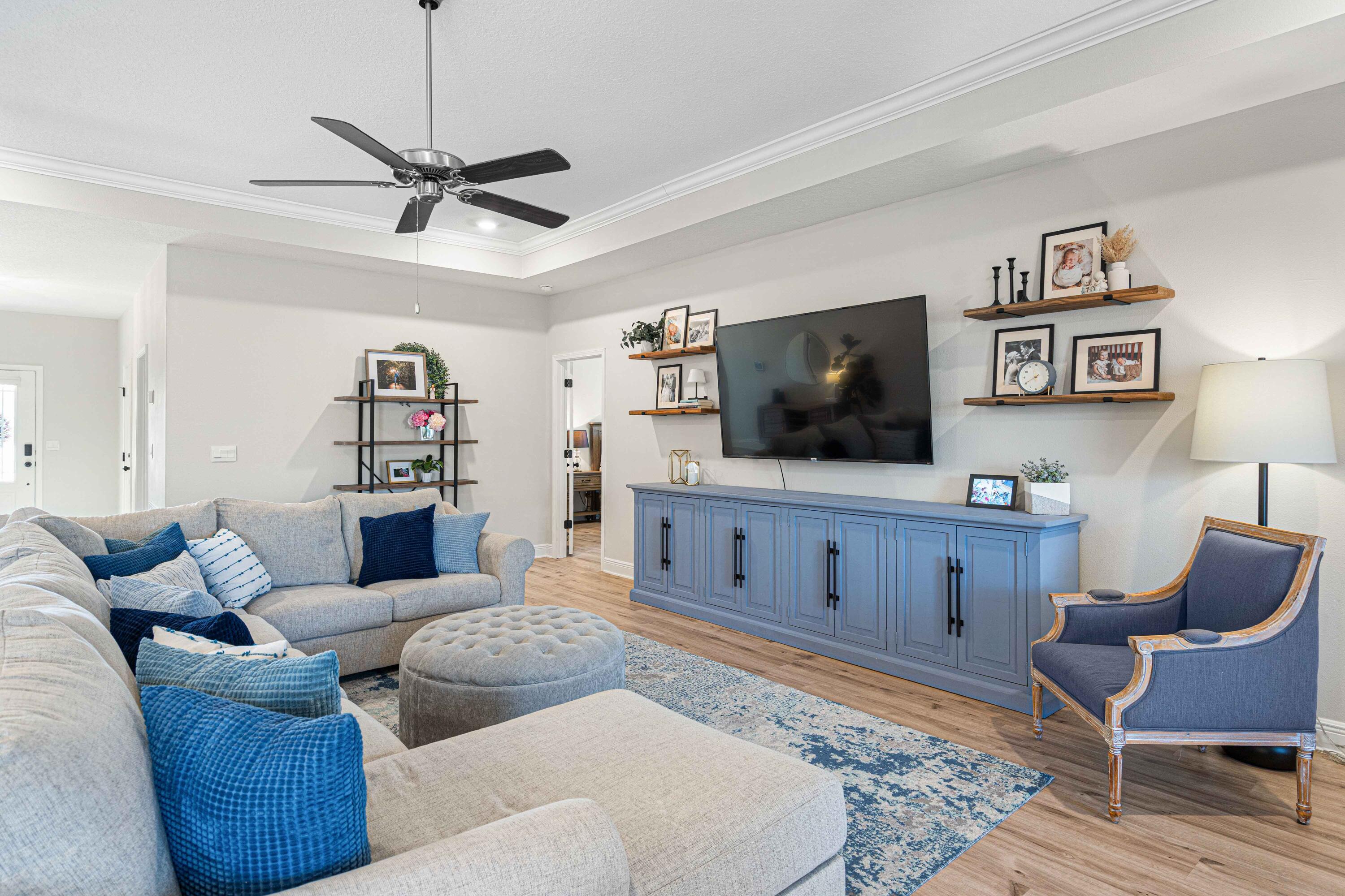 58 Siesta Circle Freeport, FL 32439 - Photo 12 of 45 a living room with furniture a flat screen tv and kitchen view