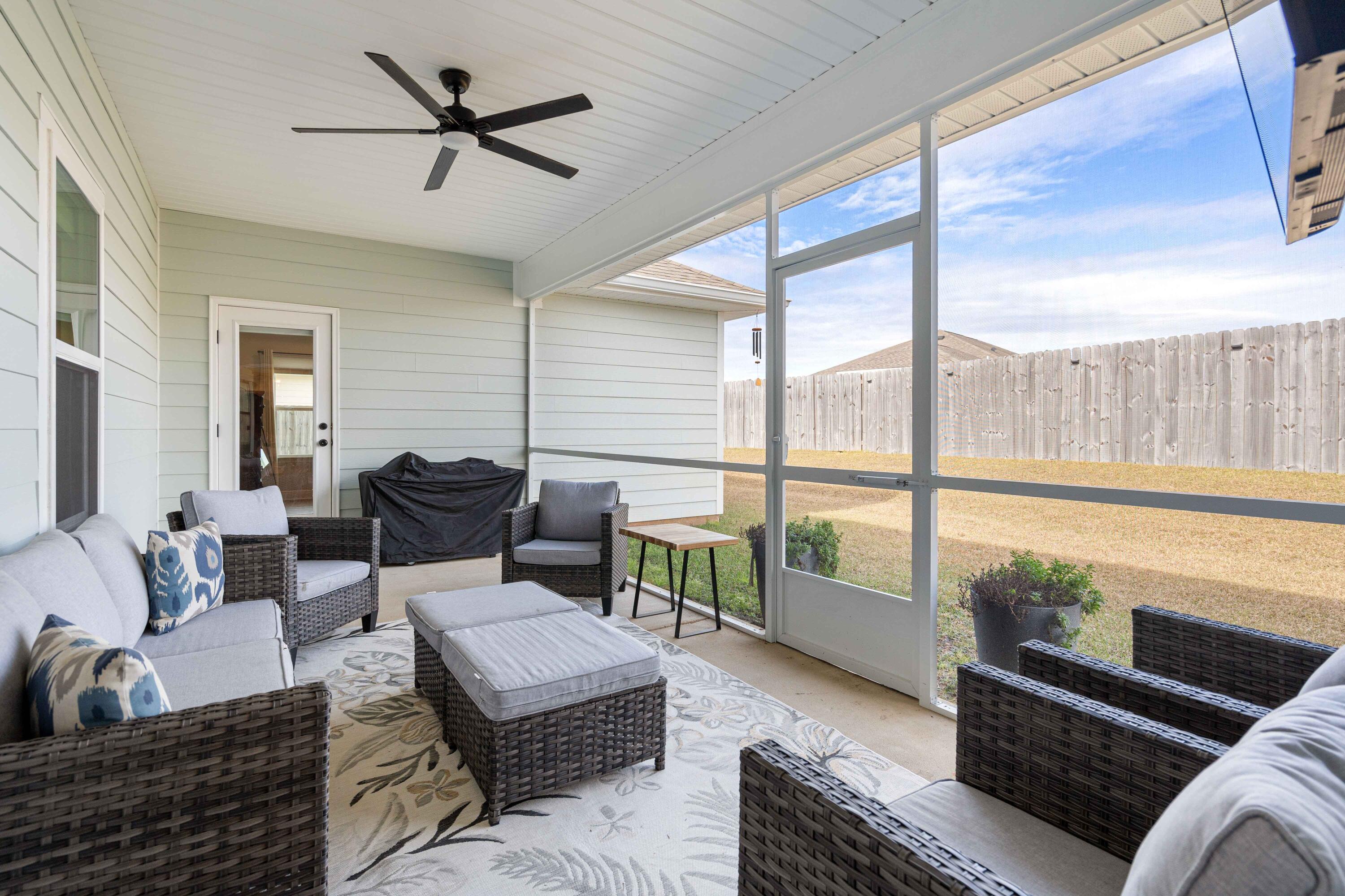 58 Siesta Circle Freeport, FL 32439 - Photo 18 of 40 a living room with furniture and a large window