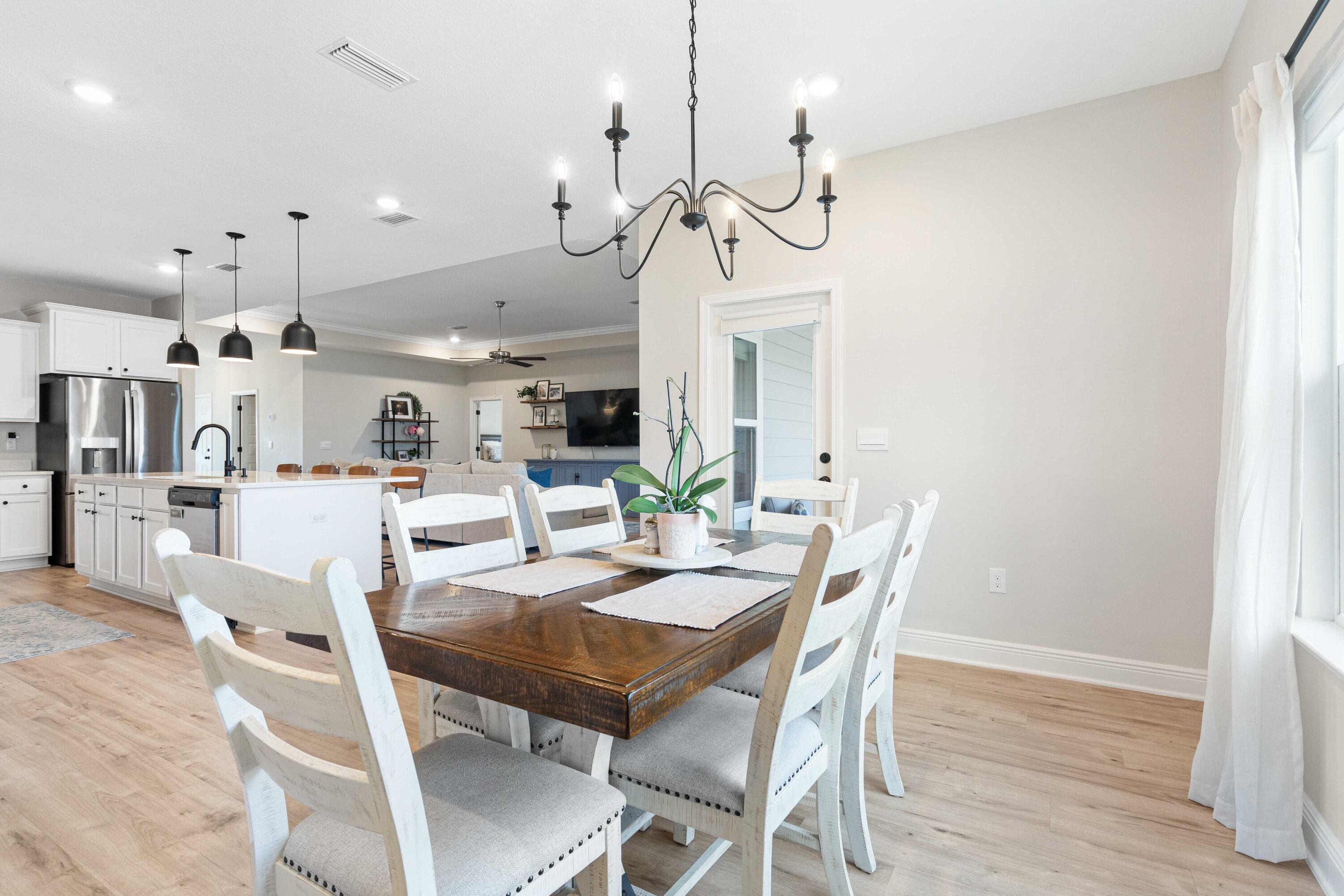 58 Siesta Circle Freeport, FL 32439 - Photo 20 of 45 a view of a dining room with furniture and wooden floor