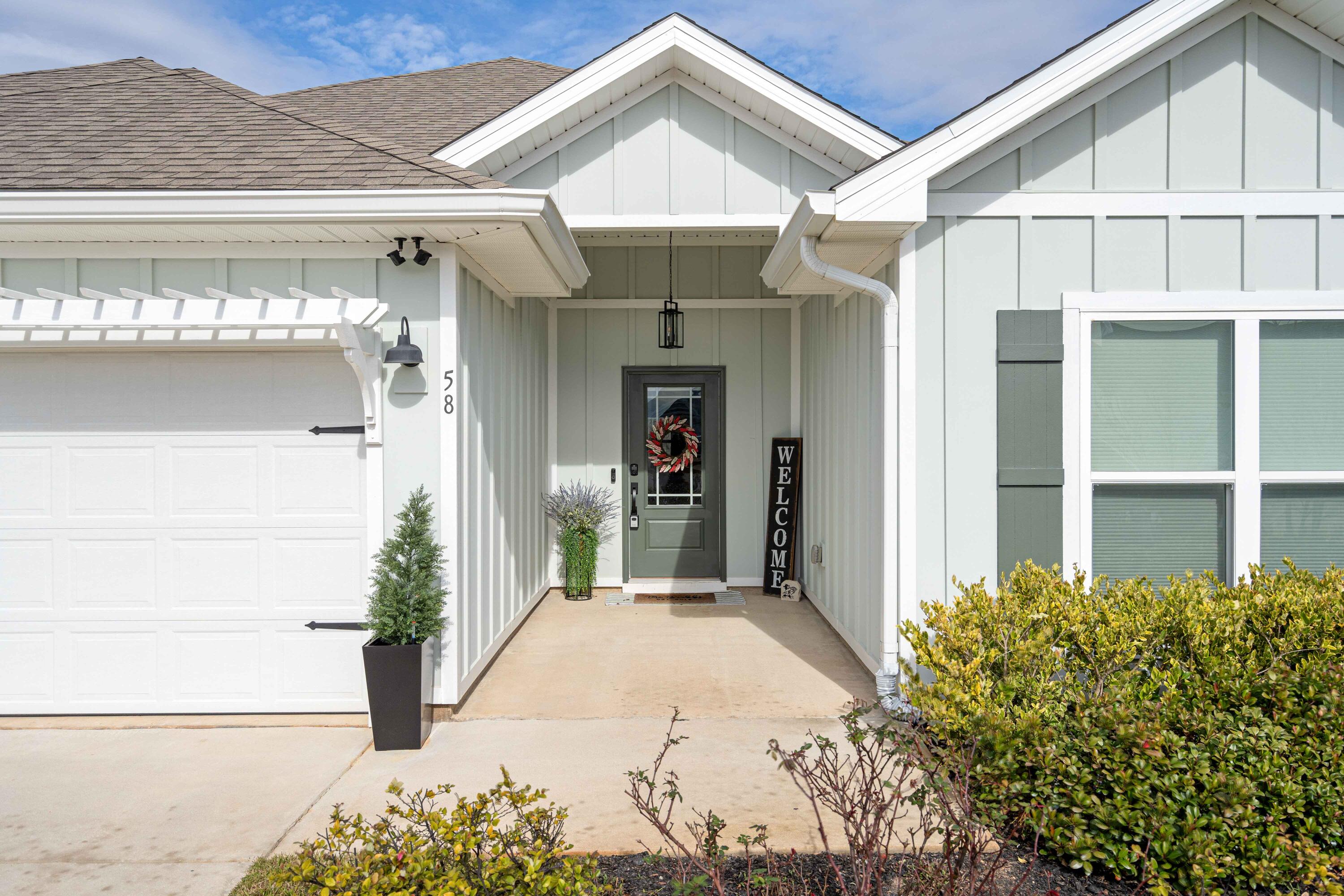 58 Siesta Circle Freeport, FL 32439 - Photo 2 of 40 a view of a entrance gate of the house