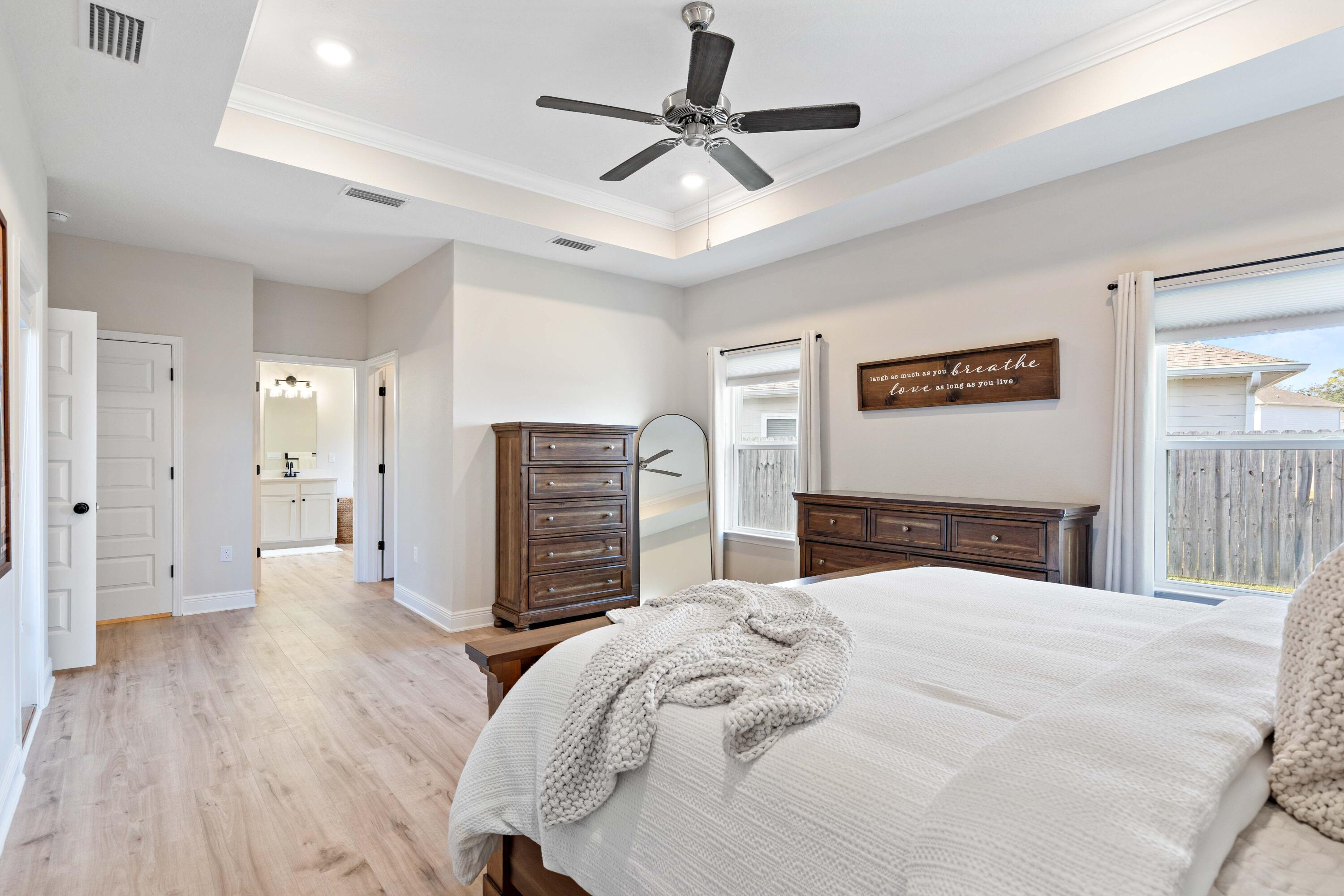 58 Siesta Circle Freeport, FL 32439 - Photo 22 of 40 a bedroom with a bed and a ceiling fan