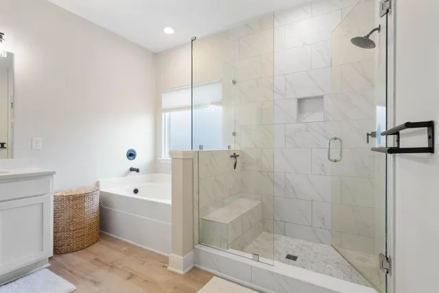a bathroom with a bathtub and a shower