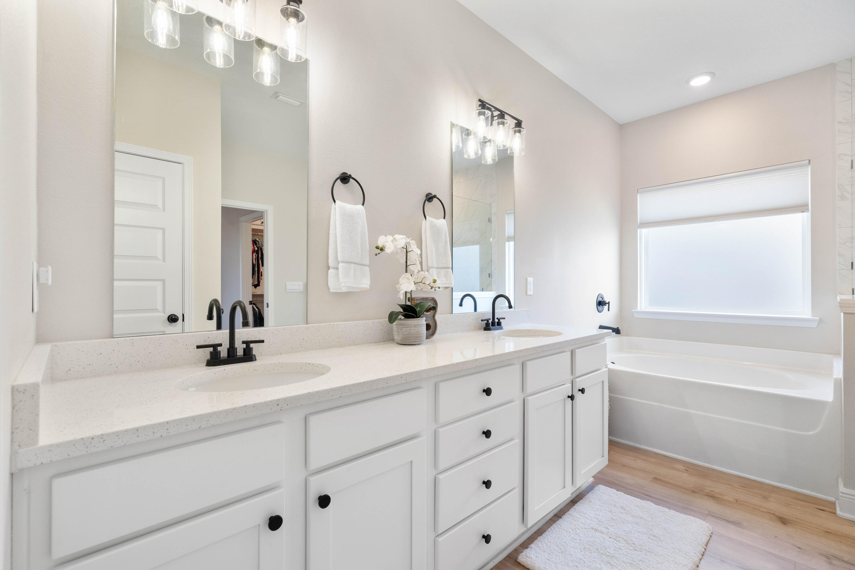 58 Siesta Circle Freeport, FL 32439 - Photo 24 of 40 a bathroom with a double vanity sink mirror double and bathtub