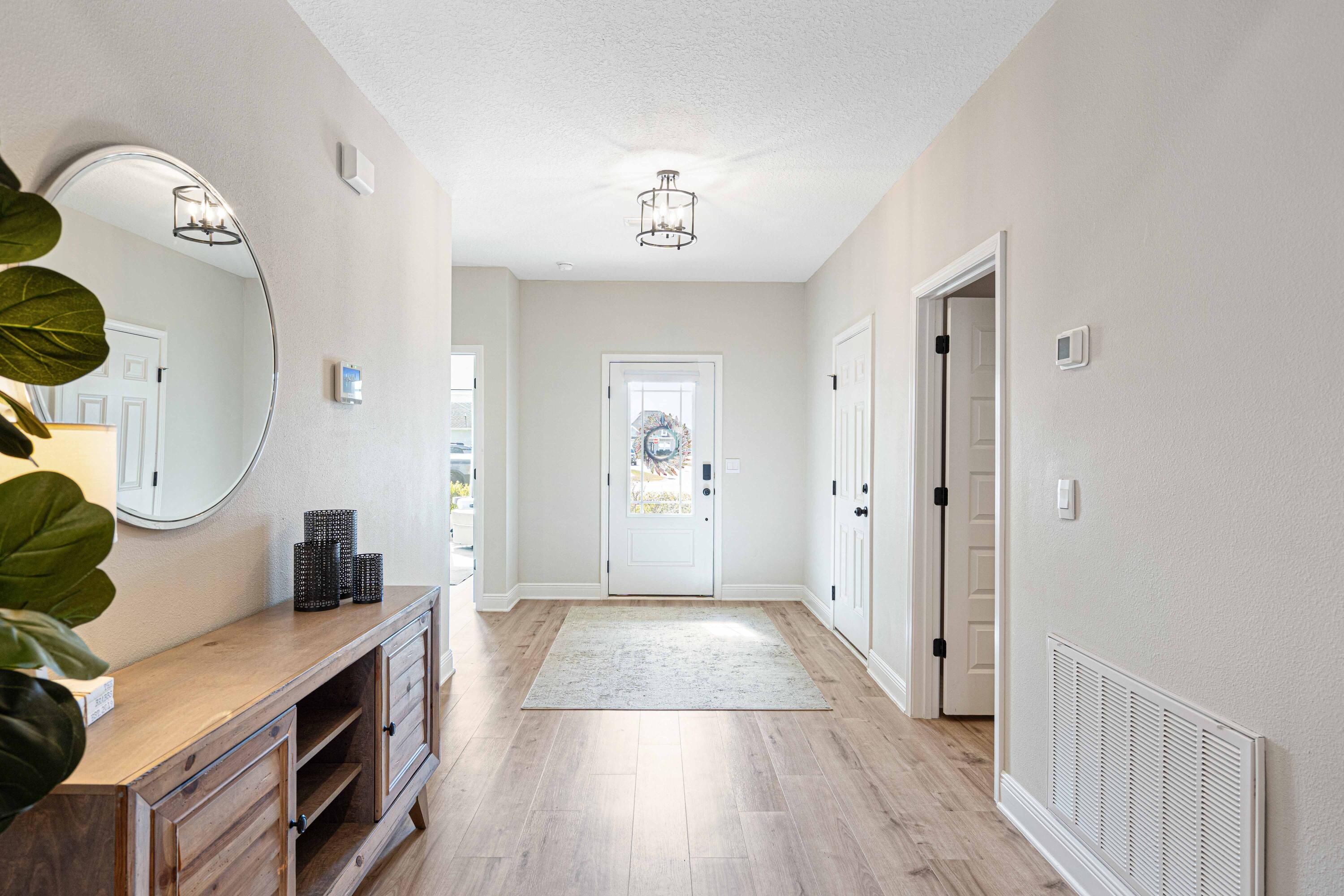 58 Siesta Circle Freeport, FL 32439 - Photo 3 of 40 a view of a hallway with wooden floor