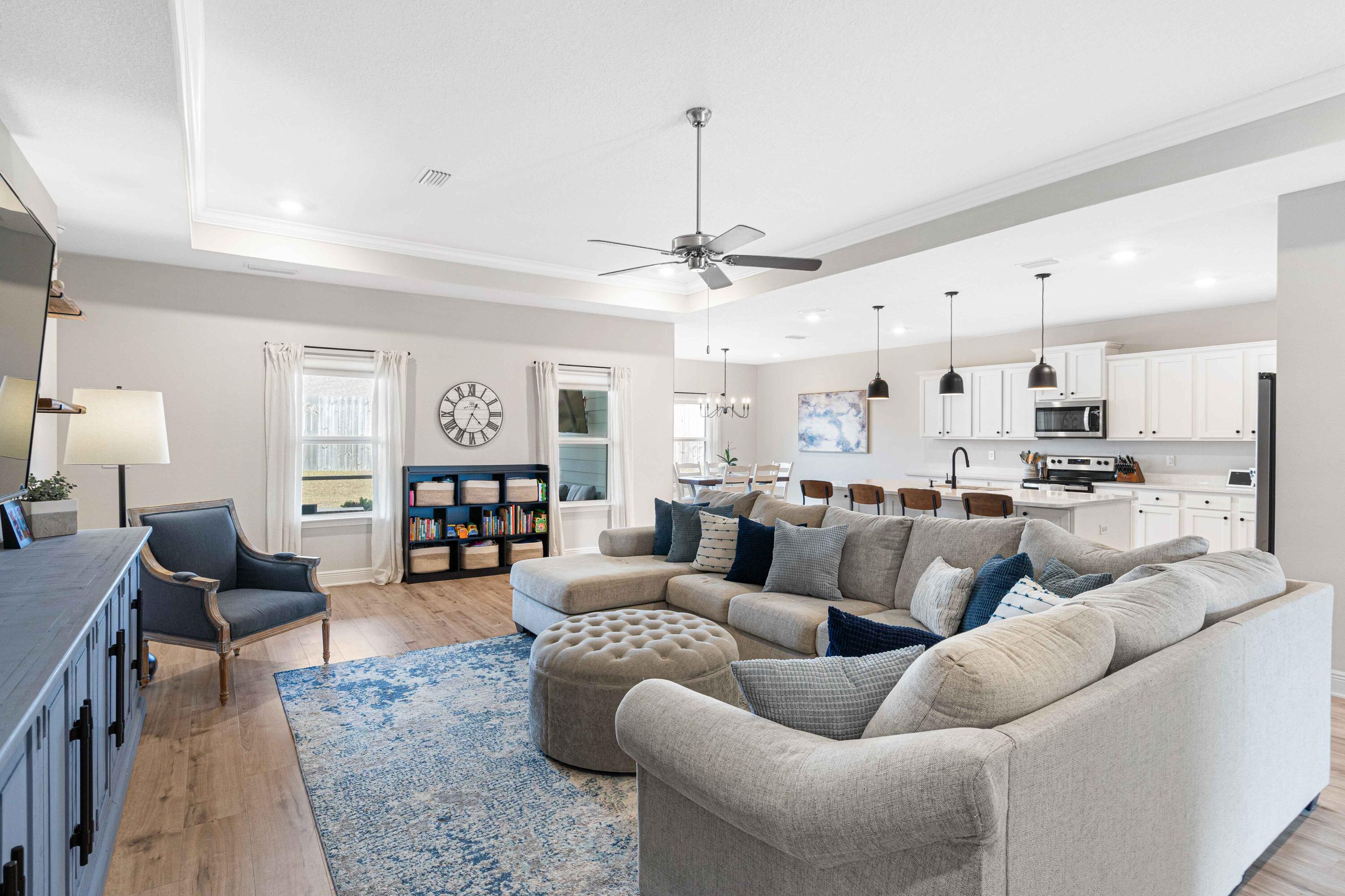 58 Siesta Circle Freeport, FL 32439 - Photo 3 of 45 a living room with furniture kitchen view and a chandelier