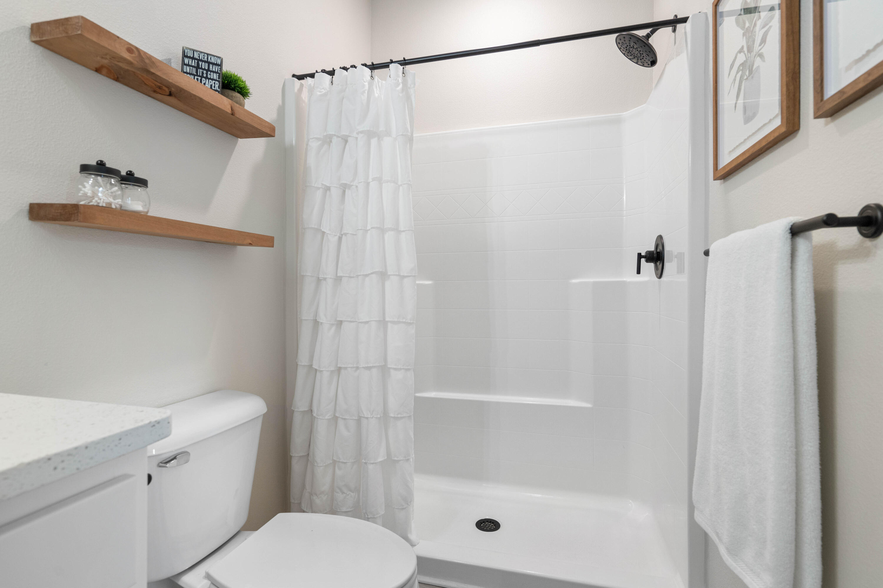 58 Siesta Circle Freeport, FL 32439 - Photo 35 of 40 a bathroom with a shower a toilet and a sink