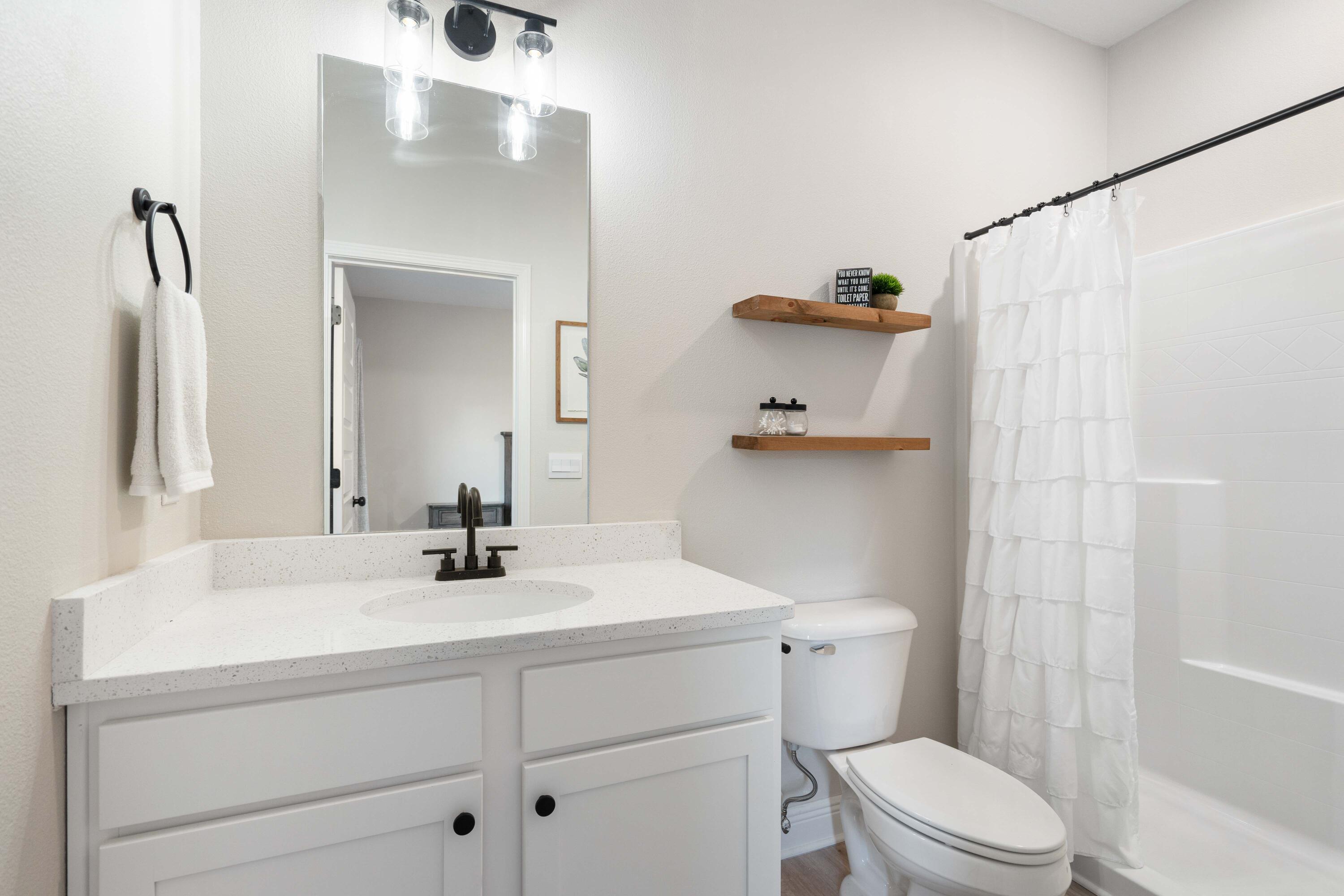 58 Siesta Circle Freeport, FL 32439 - Photo 36 of 40 a bathroom with a sink a toilet and shower