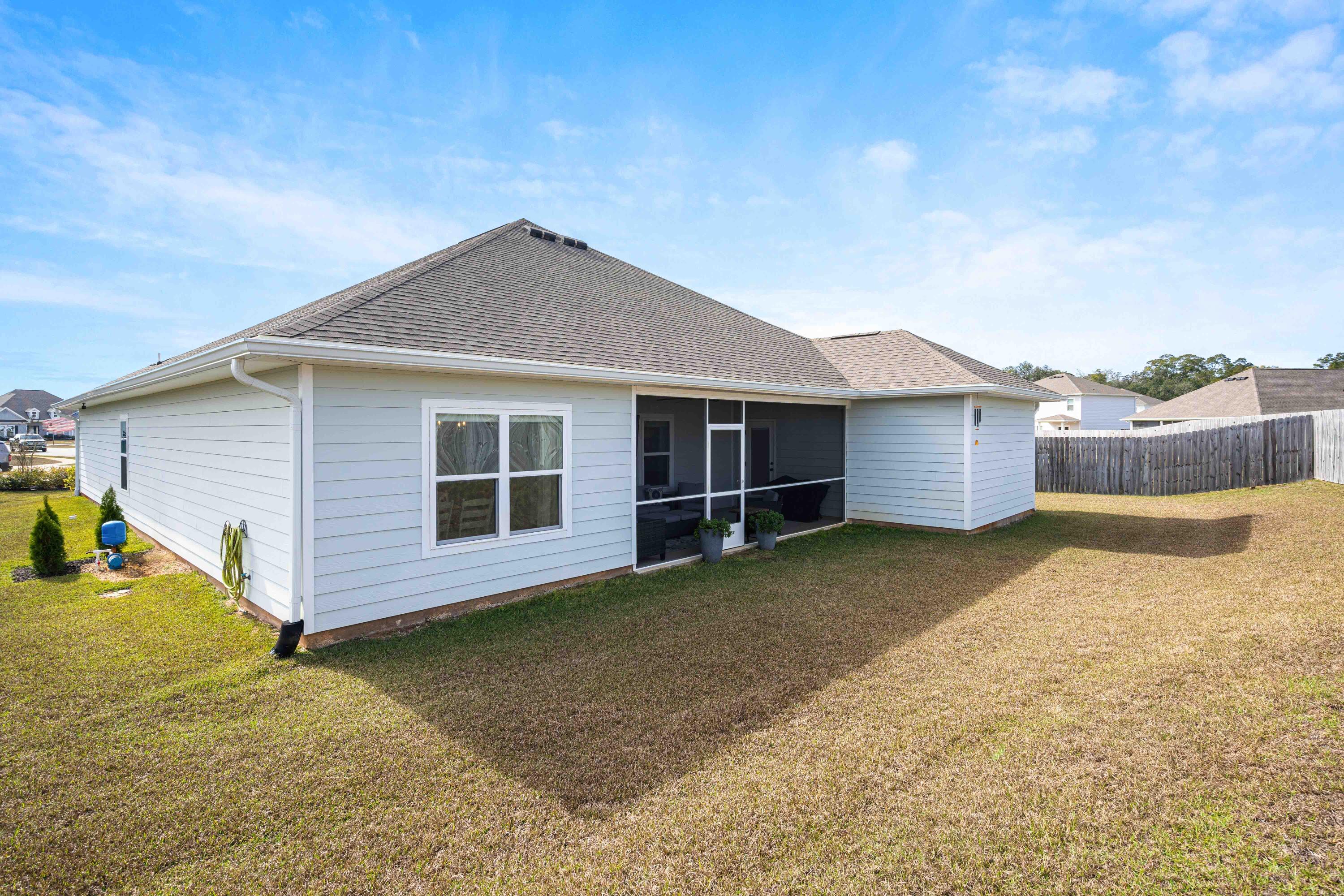 58 Siesta Circle Freeport, FL 32439 - Photo 38 of 40 a view of a house with a yard