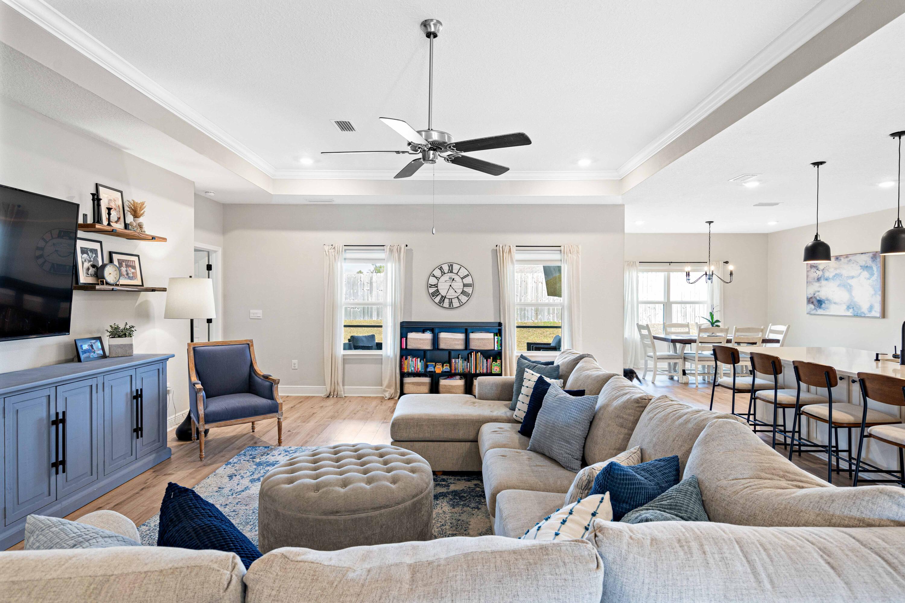 58 Siesta Circle Freeport, FL 32439 - Photo 10 of 45 a living room with furniture kitchen view and a chandelier