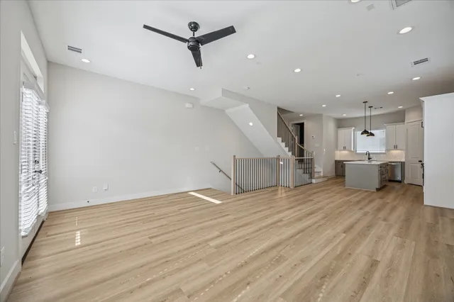 a spacious bathroom with double sink and a large mirror