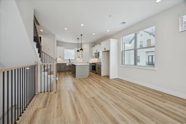 a bathroom with a tub a sink and mirror