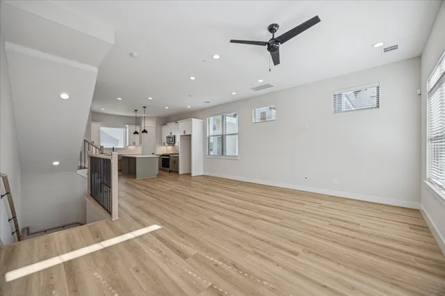 a bathroom with a sink a toilet a mirror and shower