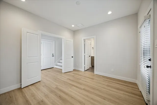 a kitchen with stainless steel appliances a stove a microwave and wooden cabinets