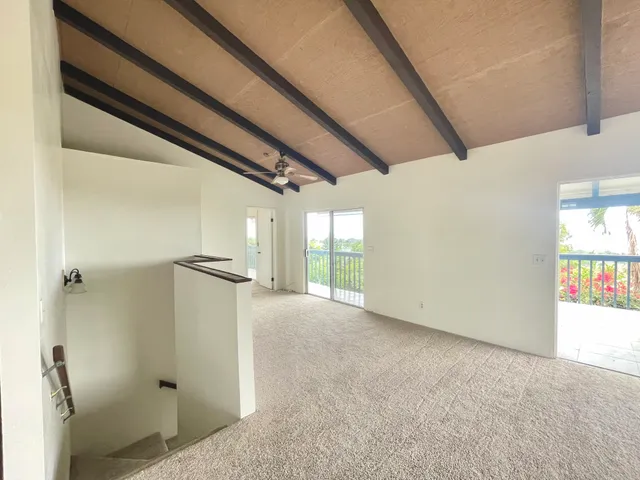 an empty room with windows and windows