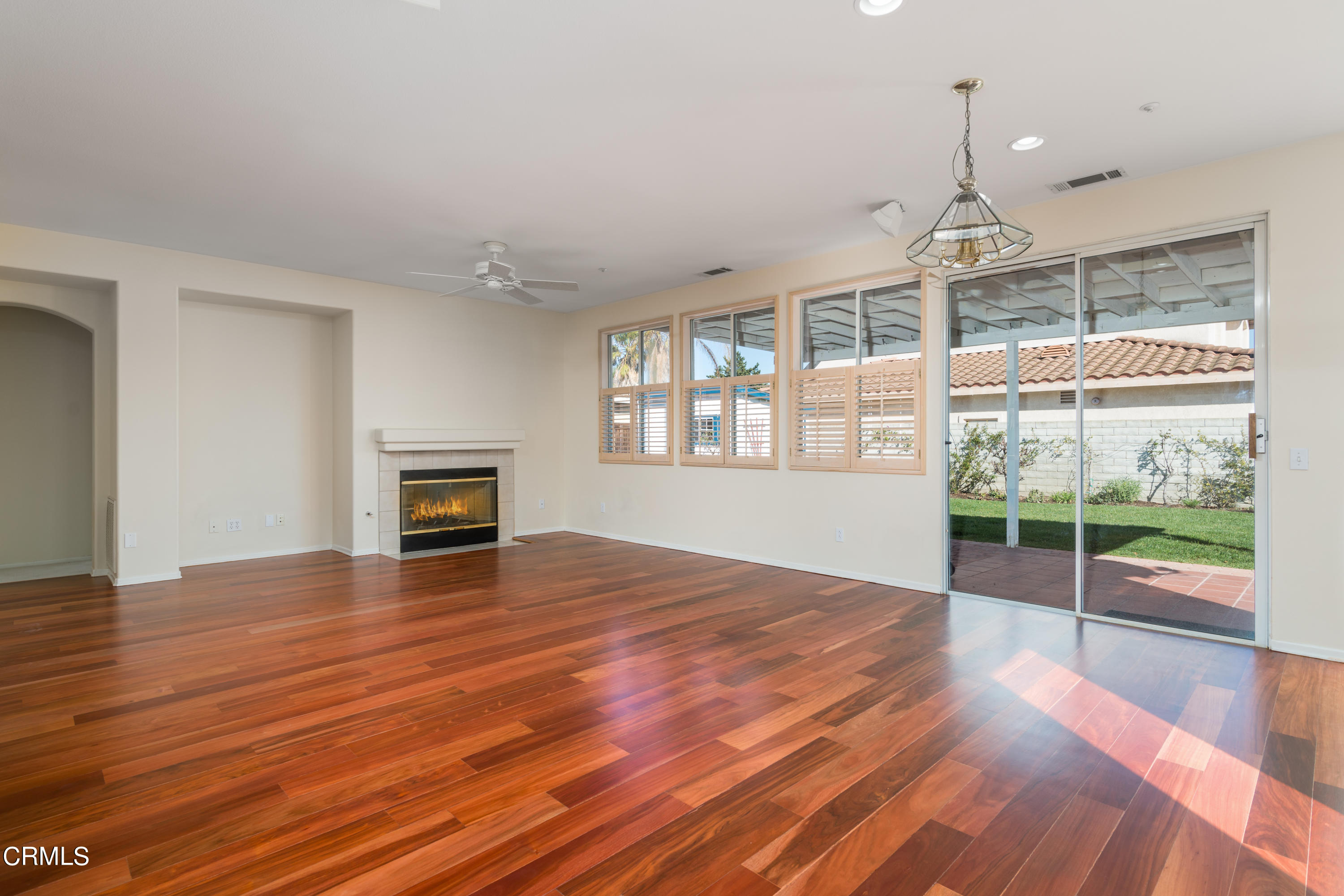 810 Rosalinda Drive Oxnard, CA 93030 - Photo 11 of 24 an empty room with wooden floor and windows