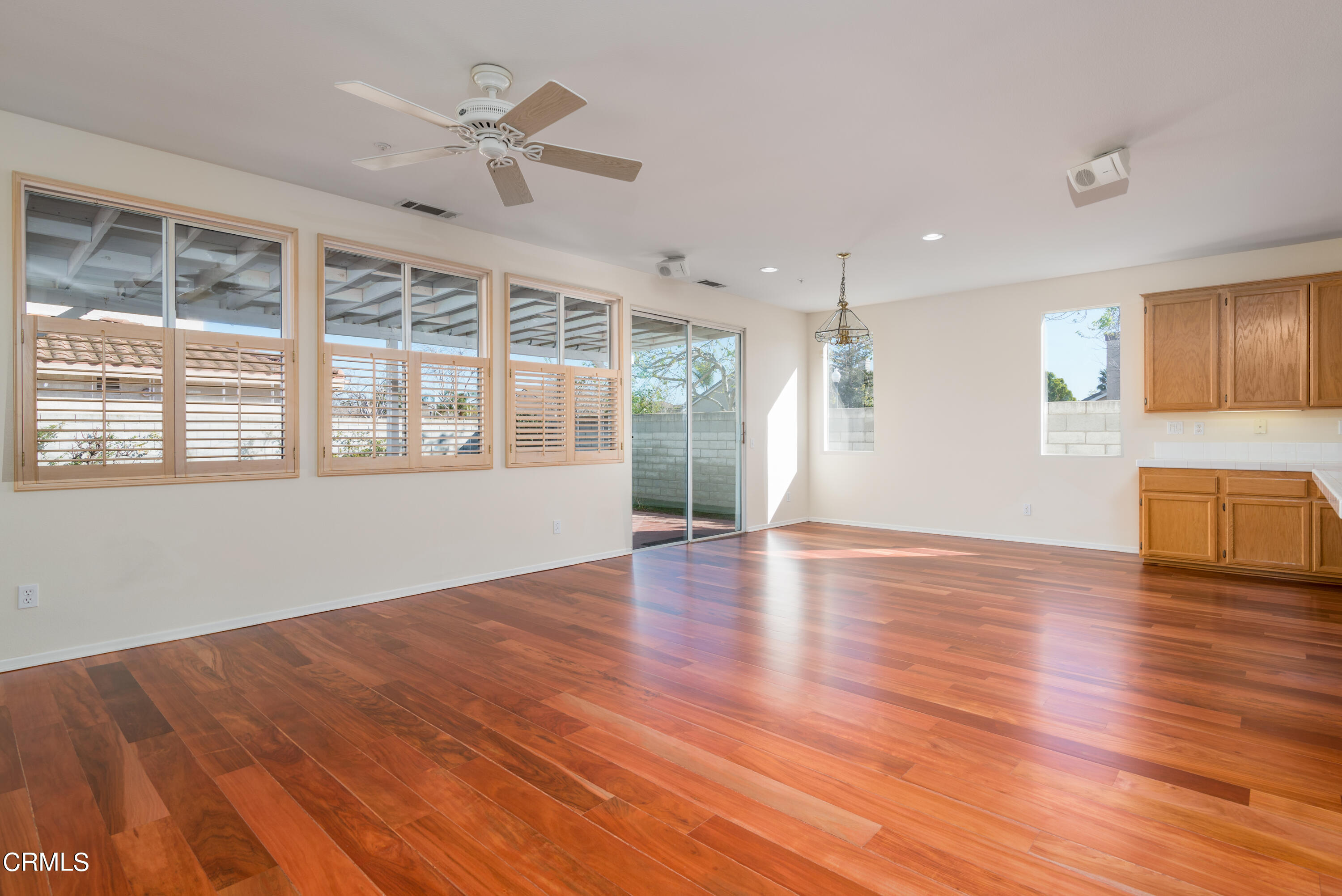 810 Rosalinda Drive Oxnard, CA 93030 - Photo 13 of 24 a view of an empty room with a kitchen and wooden floor
