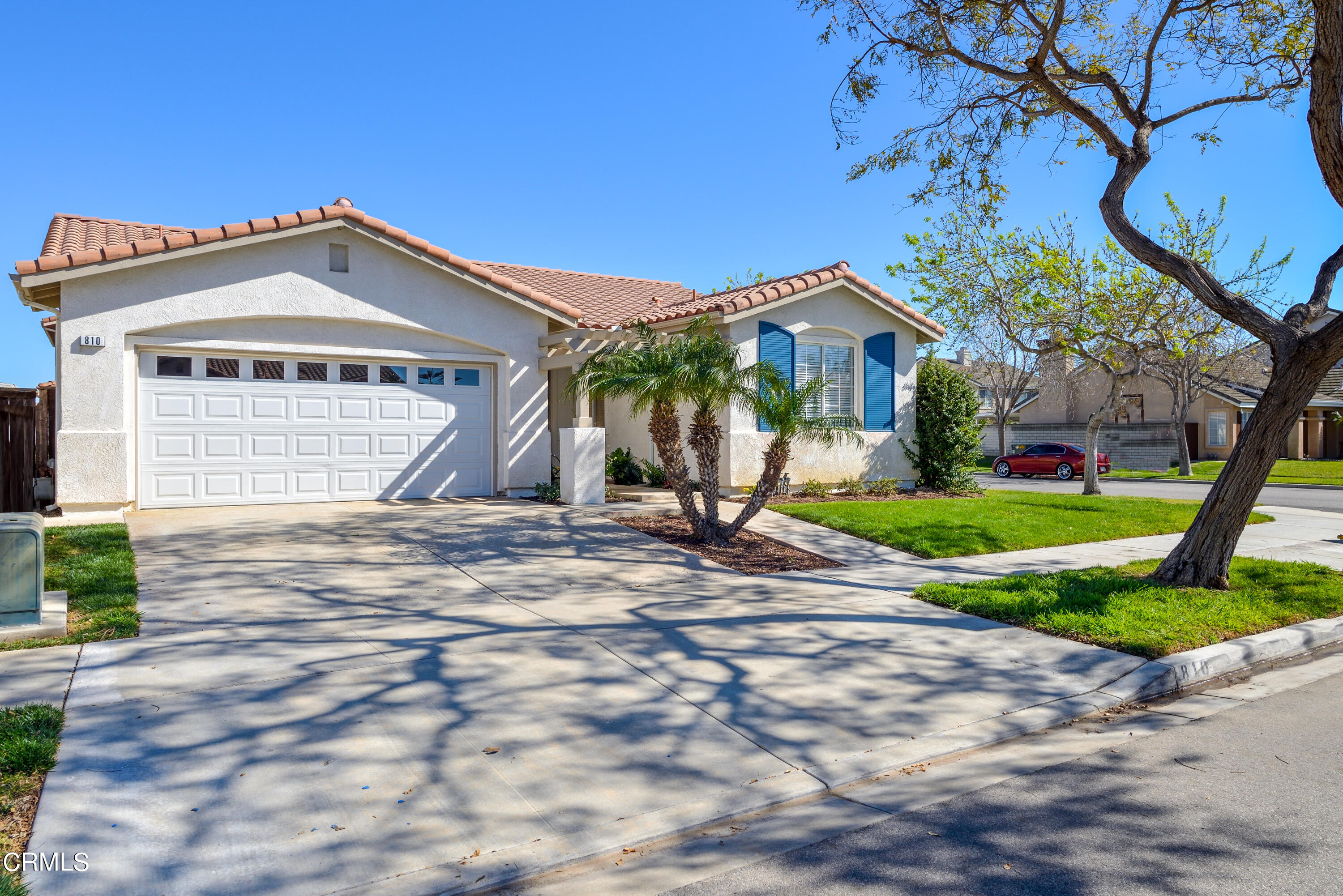 810 Rosalinda Drive Oxnard, CA 93030 - Photo 24 of 24 a front view of a house with a yard and garage