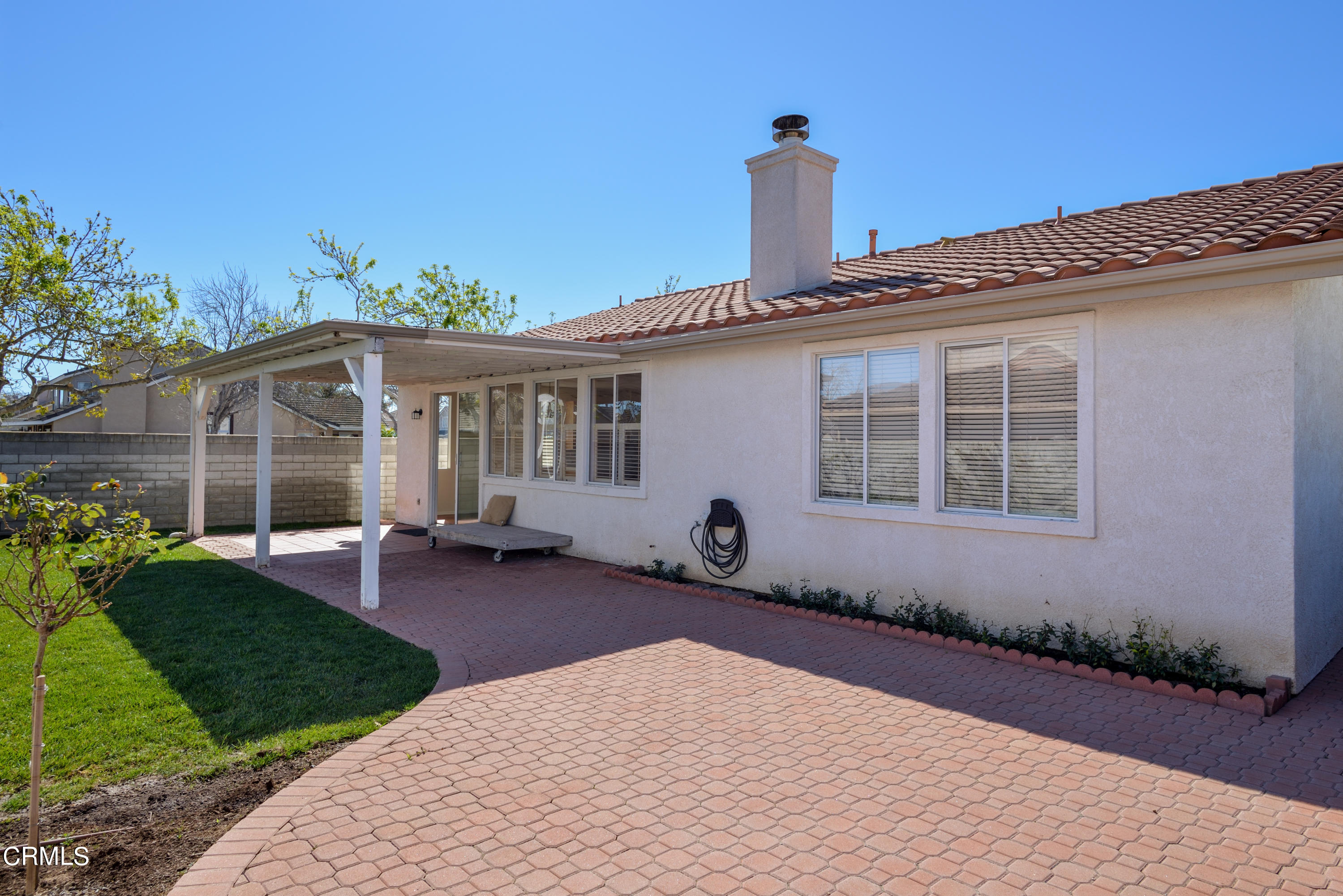 810 Rosalinda Drive Oxnard, CA 93030 - Photo 6 of 24 a front view of a house with a garden and patio