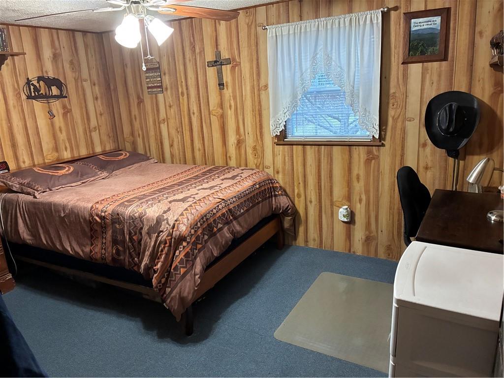 244 Manors Mill Road Dallas, GA 30157 - Photo 15 of 39 a bed sitting in a bedroom next to a window