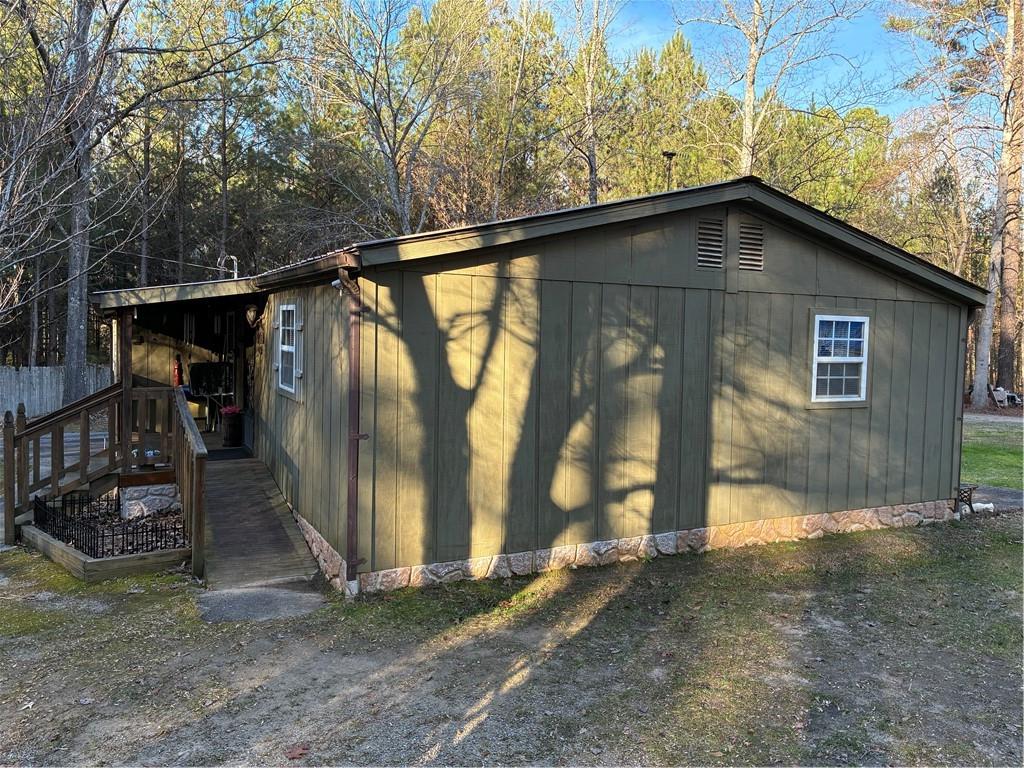 244 Manors Mill Road Dallas, GA 30157 - Photo 21 of 39 a house with trees in the background