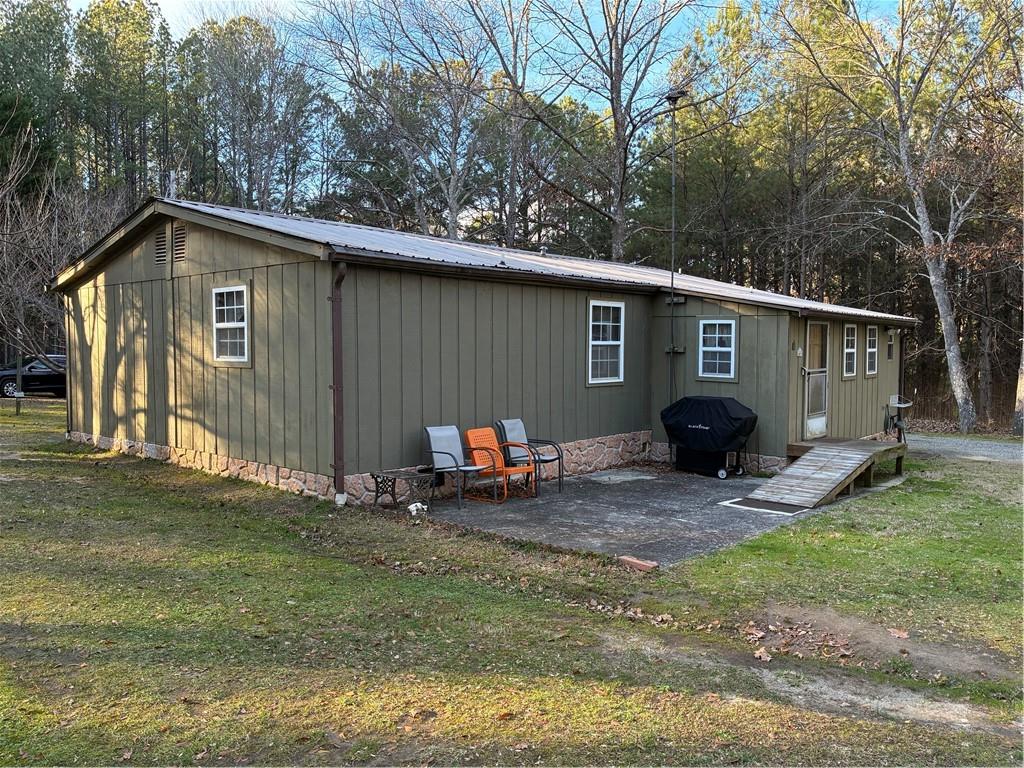 244 Manors Mill Road Dallas, GA 30157 - Photo 22 of 39 a view of a house with backyard
