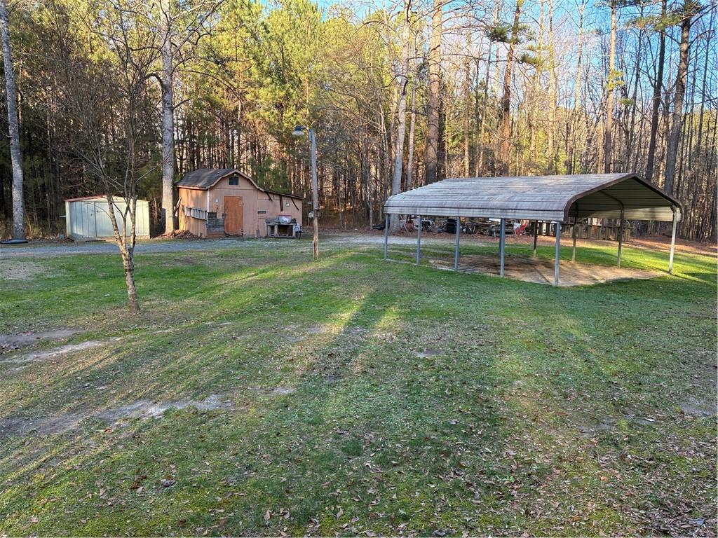 244 Manors Mill Road Dallas, GA 30157 - Photo 23 of 39 a small pool that has a lots of plants in it
